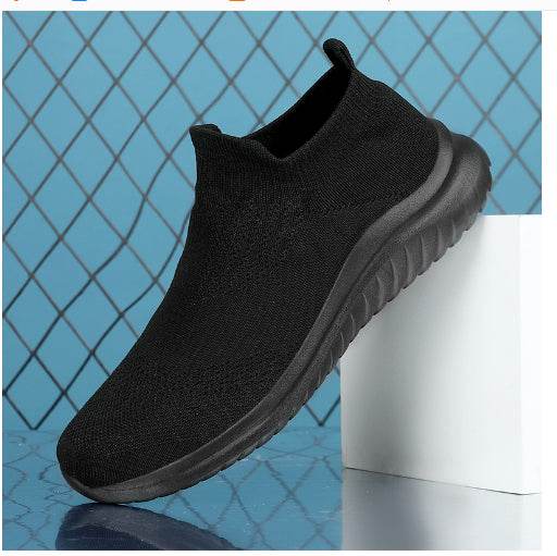 Men's white and black flying knit sneakers with mesh upper and rubber sole